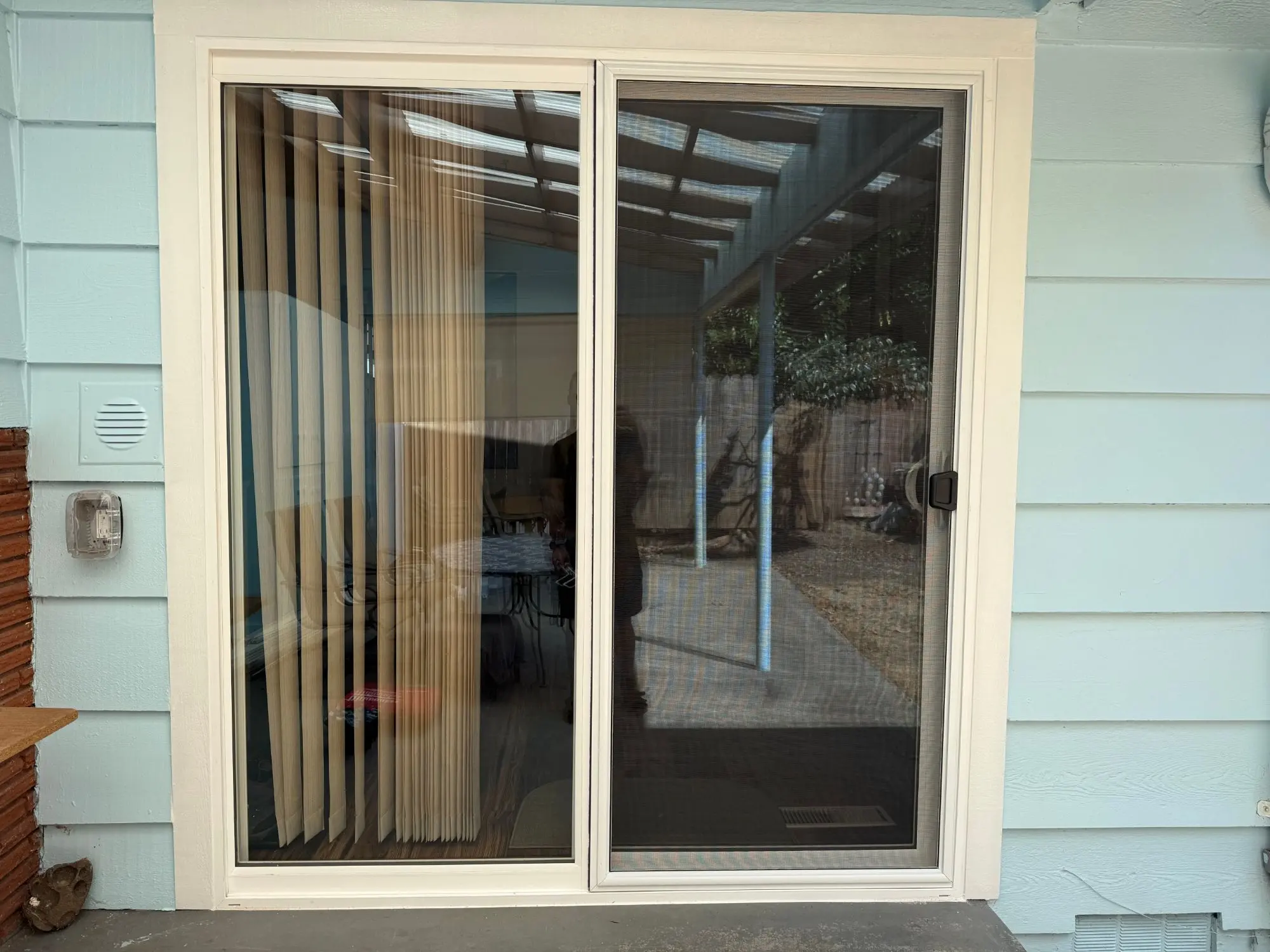Completed sliding patio door with painted trim